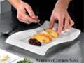 Chef Alberto Citores Sanz preparing a gourmet dish with precision and artistry.