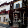 Las calles y balcones se engalanaron para el paso  del Corpus Christi de Alcalá del Río