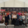 Homenaje municipal a la Asociación Cultural y Solidaria Anaquel que se ha celebrado hoy en el marco de la Feria del Libro de Sevilla.