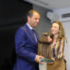 El director general de Canal Sur, Juande Mellado, recoge el premio de la Caja Rural a la institución más destacada en el apoyo y promoción de la Fiest