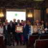Homenaje a Cáritas Diocesana y su director José Miguel Carbajo Selle, galardonados con el Aldabón de Sevilla por su contribución caritativa.