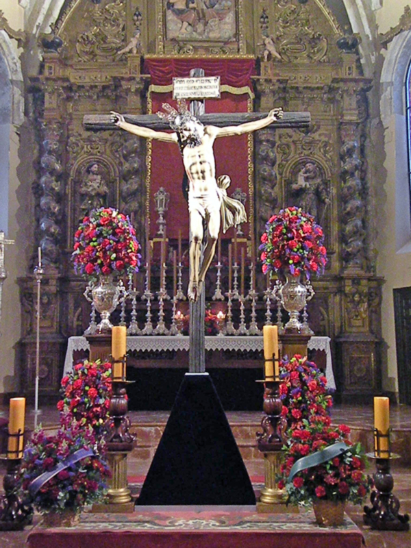 Acto de piedad y oración al Cristo del Buen Fin de Alcalá del Río en la Parroquia de Santa María de la Asunción.